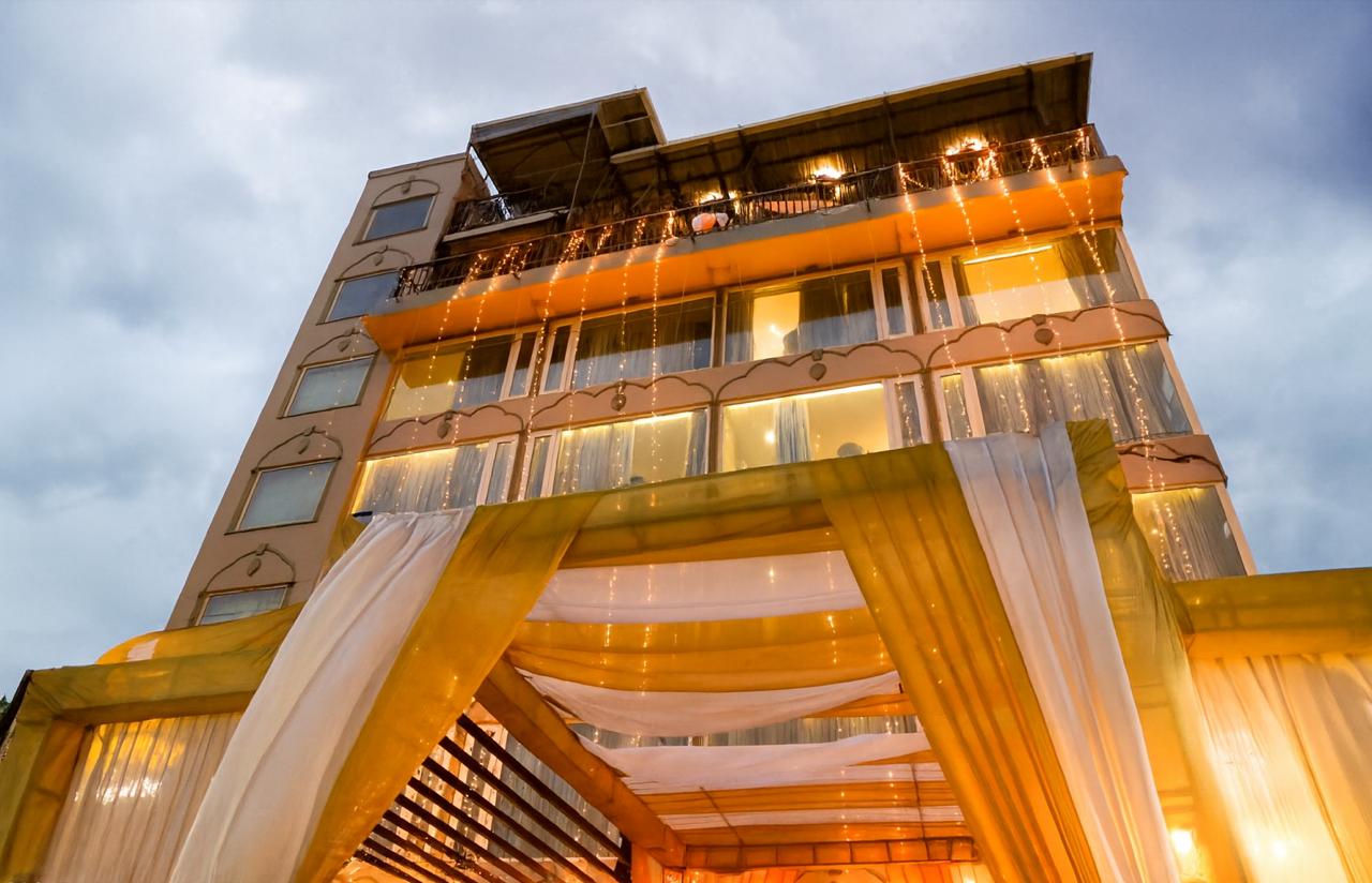 Stunning night view of a luxury wedding venue at EllBee Ganga View, Rishikesh, adorned with vibrant floral decorations and elegant lighting